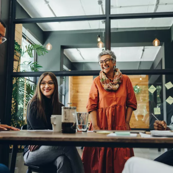 Three employees meeting at main table