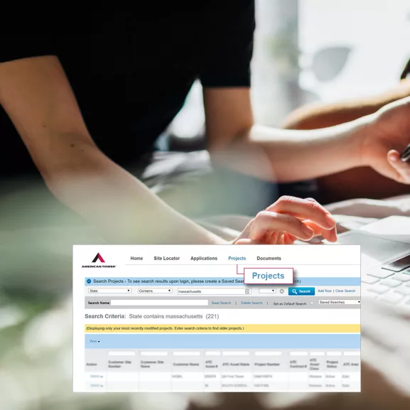 person using a phone and a laptop to track their projects with atcs site locator