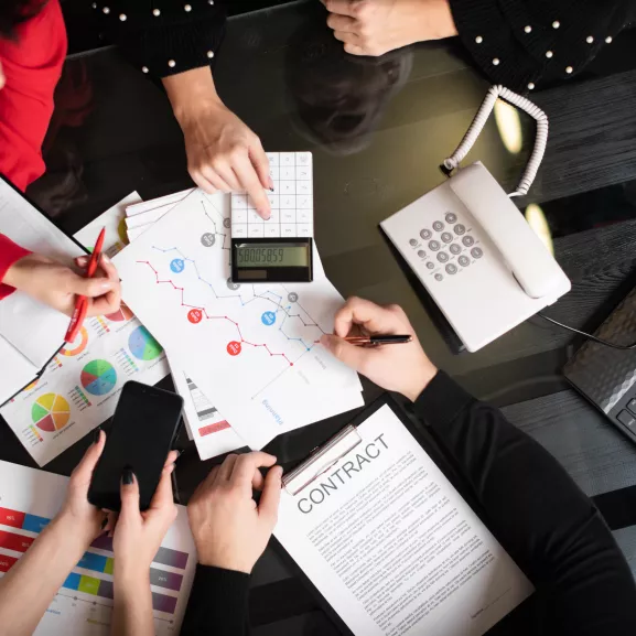 Business team collaborating on a project at a table.