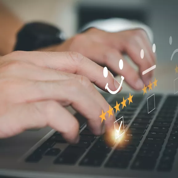 Hands typing on keyboard.